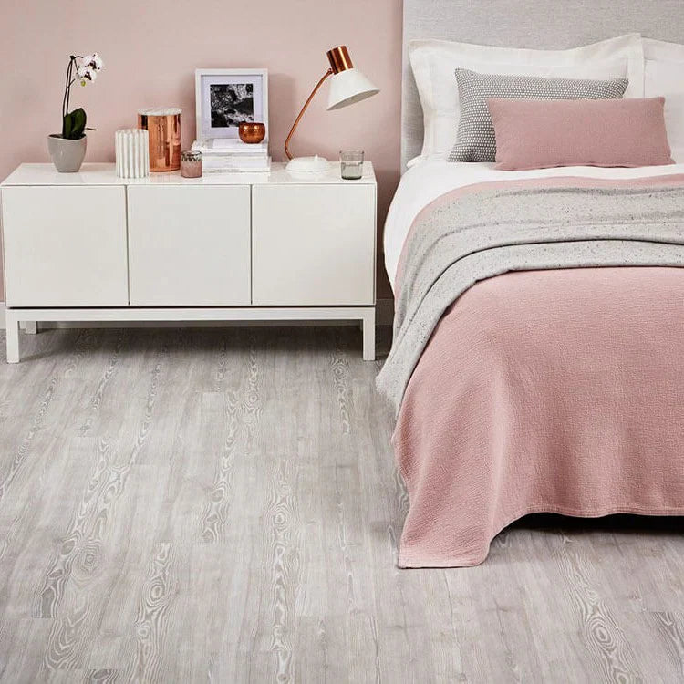 How to Layer Rugs Over Wood and Vinyl Floors Like a Pro